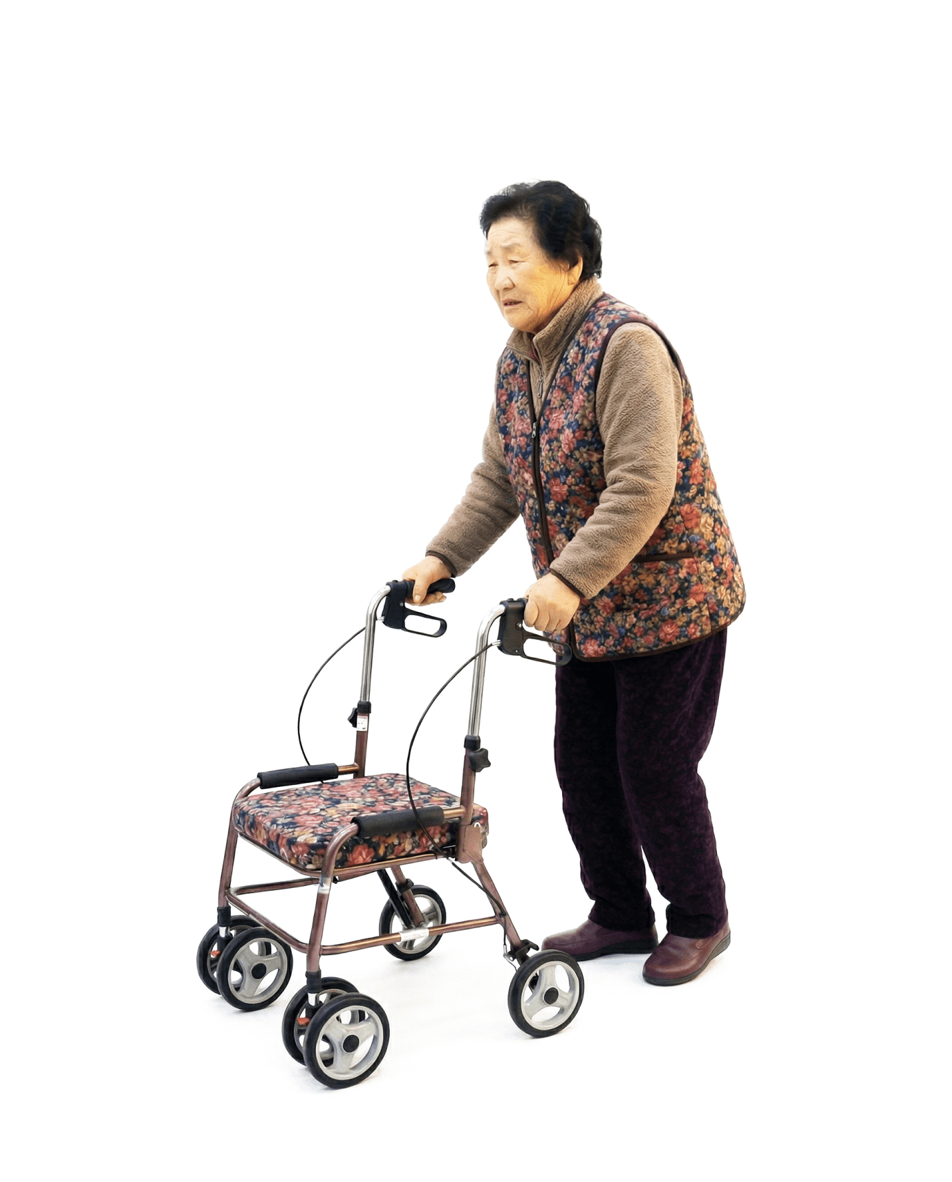 보행보조기에 의지하여 걷는 할머니